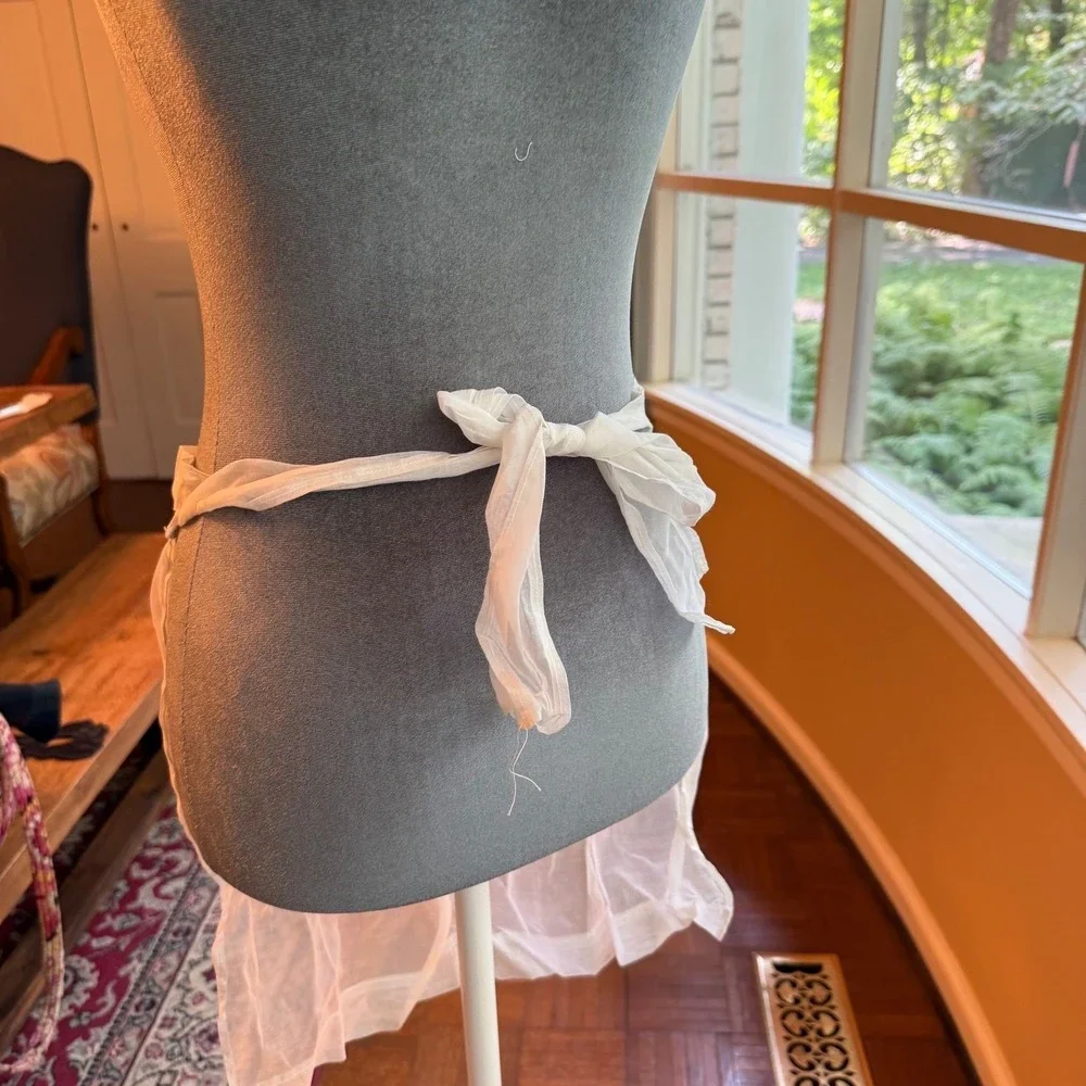 Vintage sheer chiffon or organdy half apron with lace trim and a single pocket